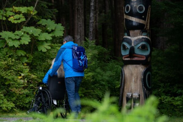 A couple walking through Sitka National Historical Park