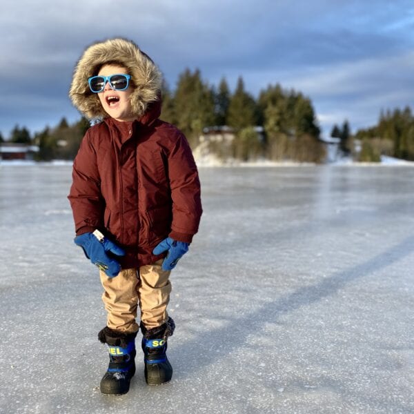 A child plays on frozen Swan Lake