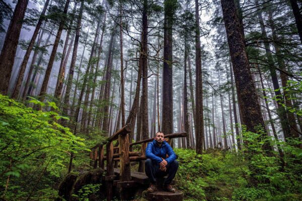 Local Sitkan taking a breather and soaking up the fresh air on the Herring Cove trail.