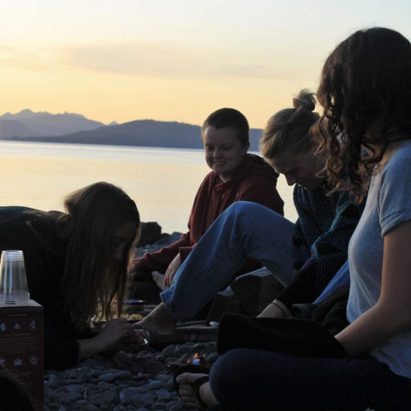 A summer sunset picnic on the beach